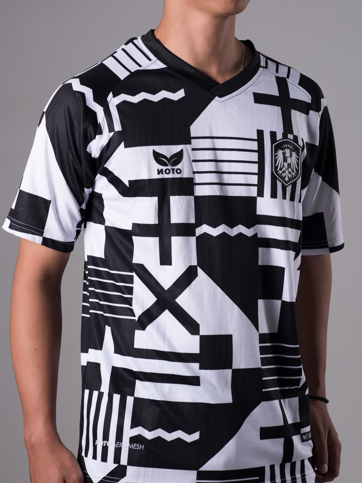Close-up of the Noto Unity jersey in a black and white graphic print