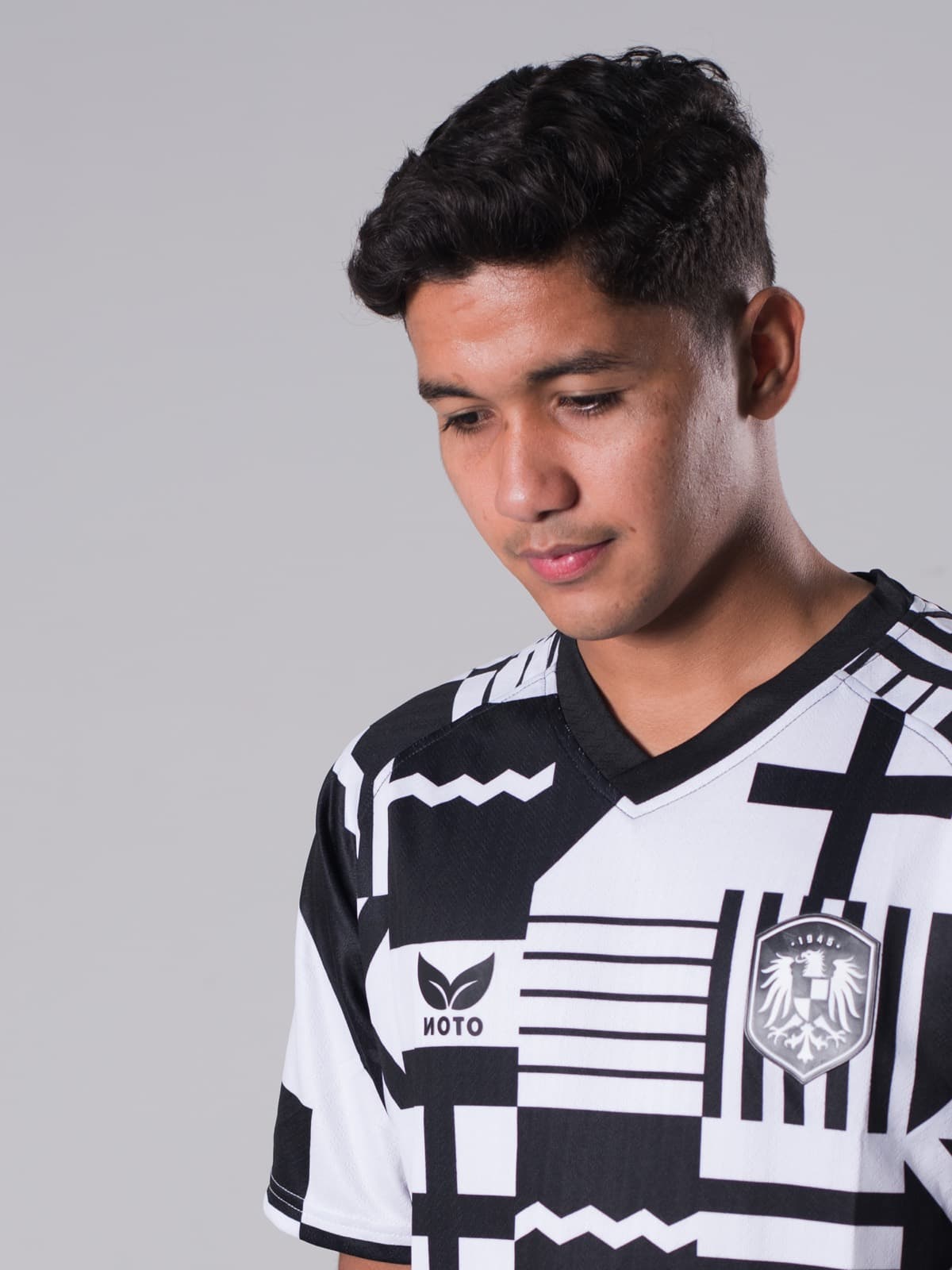 Model wearing the black and white Noto Unity jersey